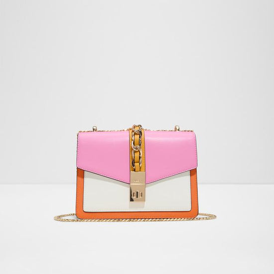 Pink and white handbag with gold chain on a light gray background