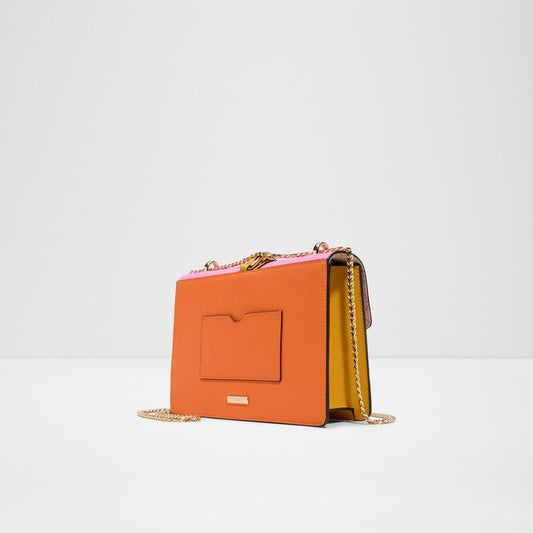 Pink and white handbag with gold chain on a light gray background